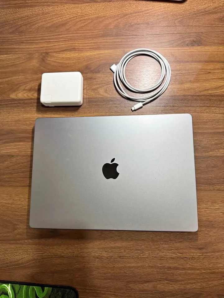 Silver MacBook Pro with its USB-C power adapter and MagSafe cable, received as a PrivateDeals referral reward