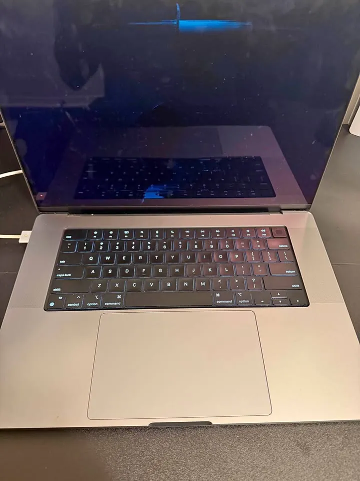 Dark MacBook Pro open on a desk, received as a PrivateDeals referral reward