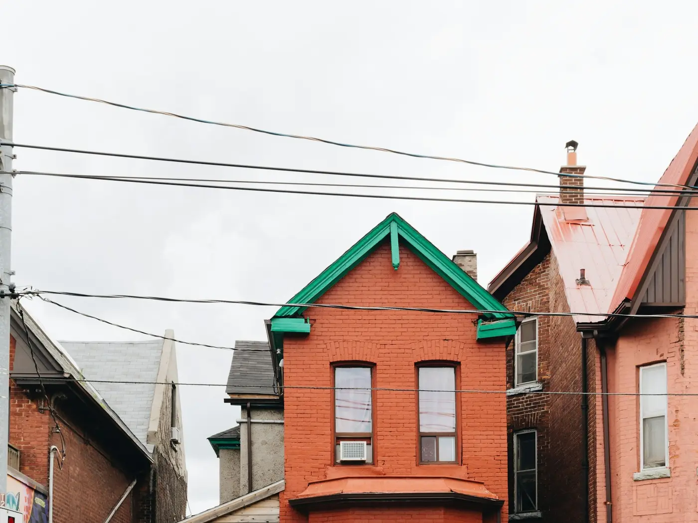 Red-brick semi-detached house with separate entrances, typical of a tenanted rental property